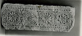 Fragment of a Frieze with Medallions, Limestone; carved